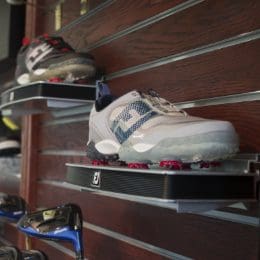 display of golf shoes in golf shop